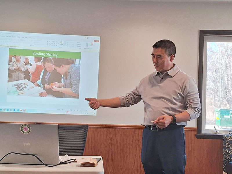 man presenting a slide