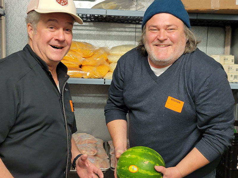 smiling men, holding watermelon