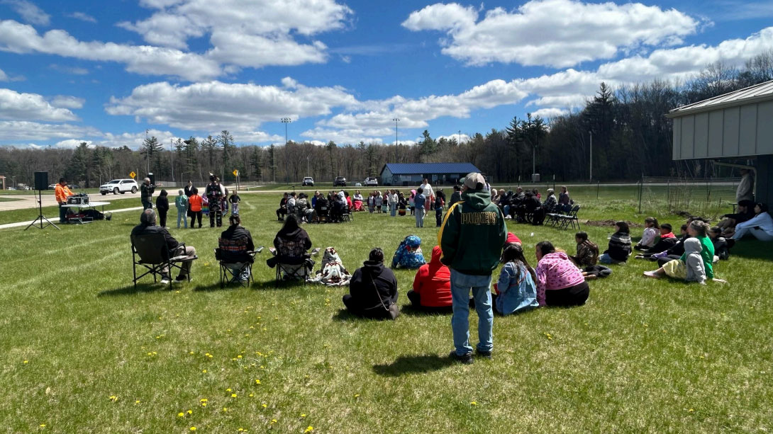 people sitting in a circle outdoors